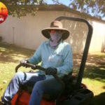Blog 5.3A Mowing the lawn with full sun protection. copy